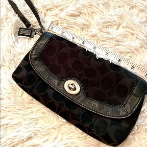 Black leather and canvas Coach wristlet.